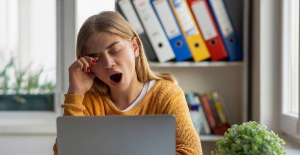 Why do eyes become watery when a person yawns?