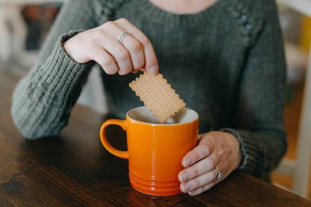 What happens to the body when a person eats biscuits with tea?