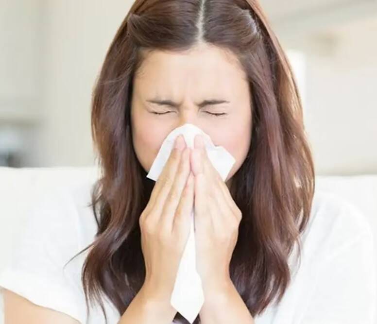 Why should a person never hold a sneeze?