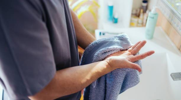 What happens if a person doesn't dry their hands after washing?