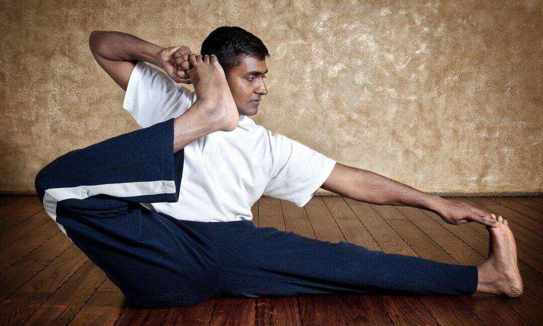 How Akarna Dhanurasana helps counter back pain from desk life