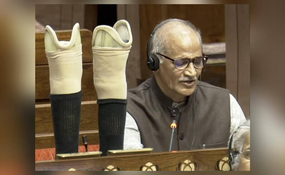BJP MP Sadanandan Master displays his artificial limps on table in Rajya Sabha during speech
