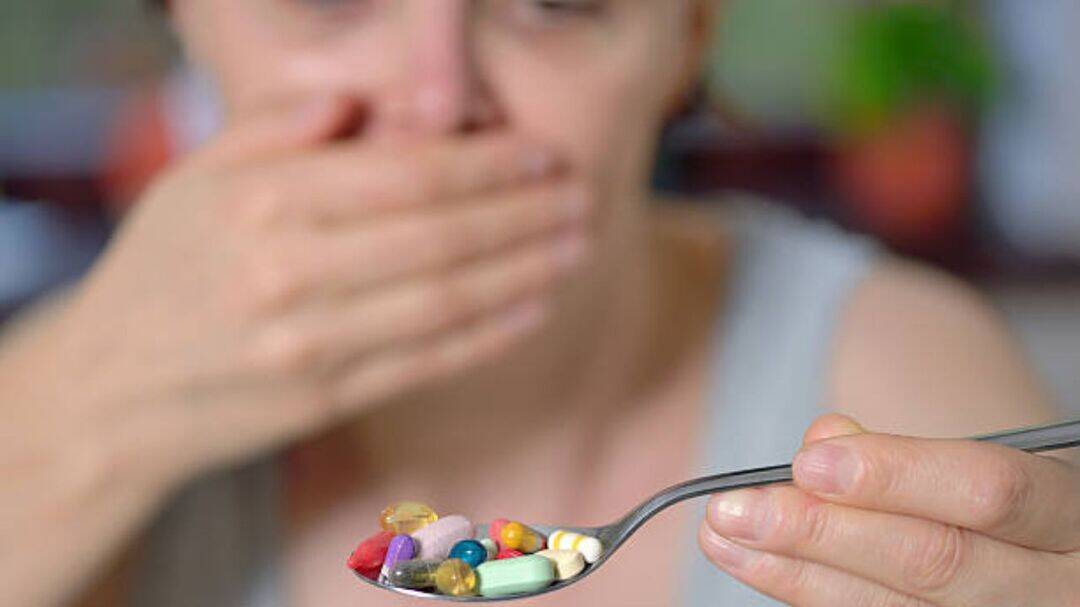 Why do taking multivitamins cause nausea in some people?