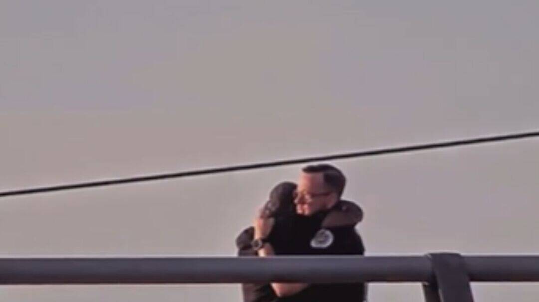 US officer saves suicidal man by listening, hugs him