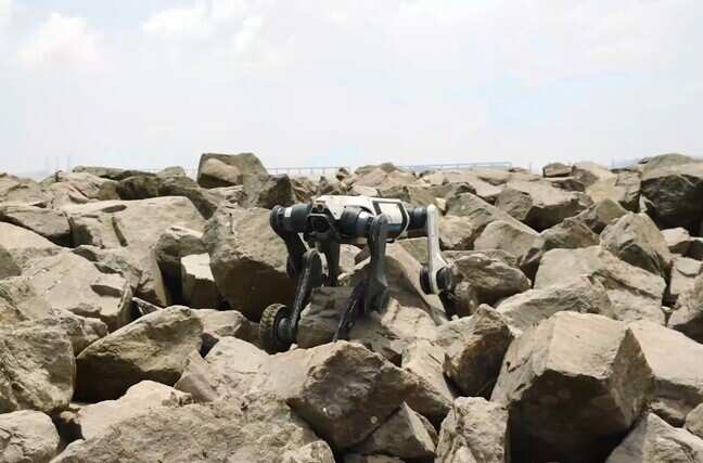 Wheeled robot seen traversing rocks, mud by adjusting its legs